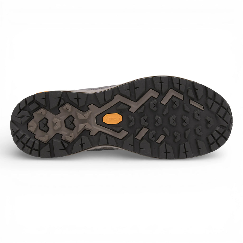 Close-up of a shoe sole with a unique tread pattern on a white background