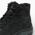 Black high-top sneaker with brand logo on a white background