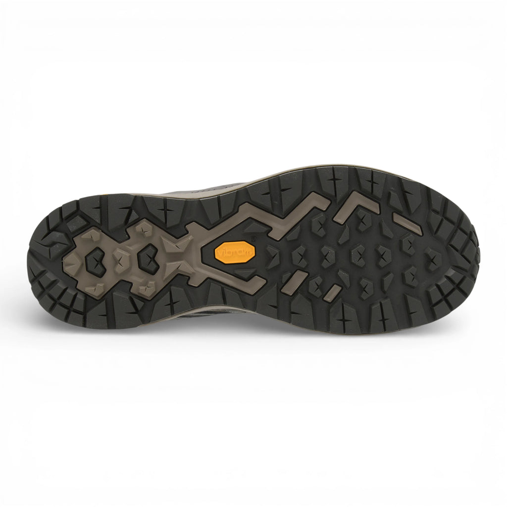 Close-up of a shoe sole with a unique tread pattern on a white background