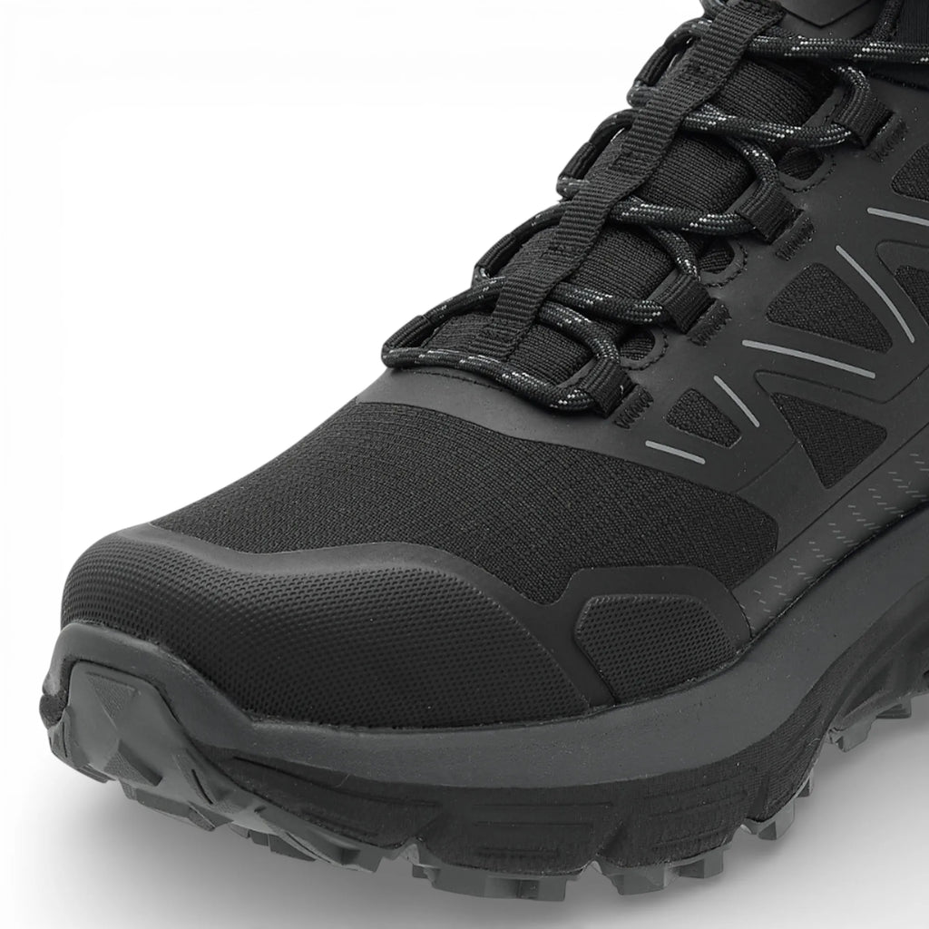 Black hiking boot with laces on a white background