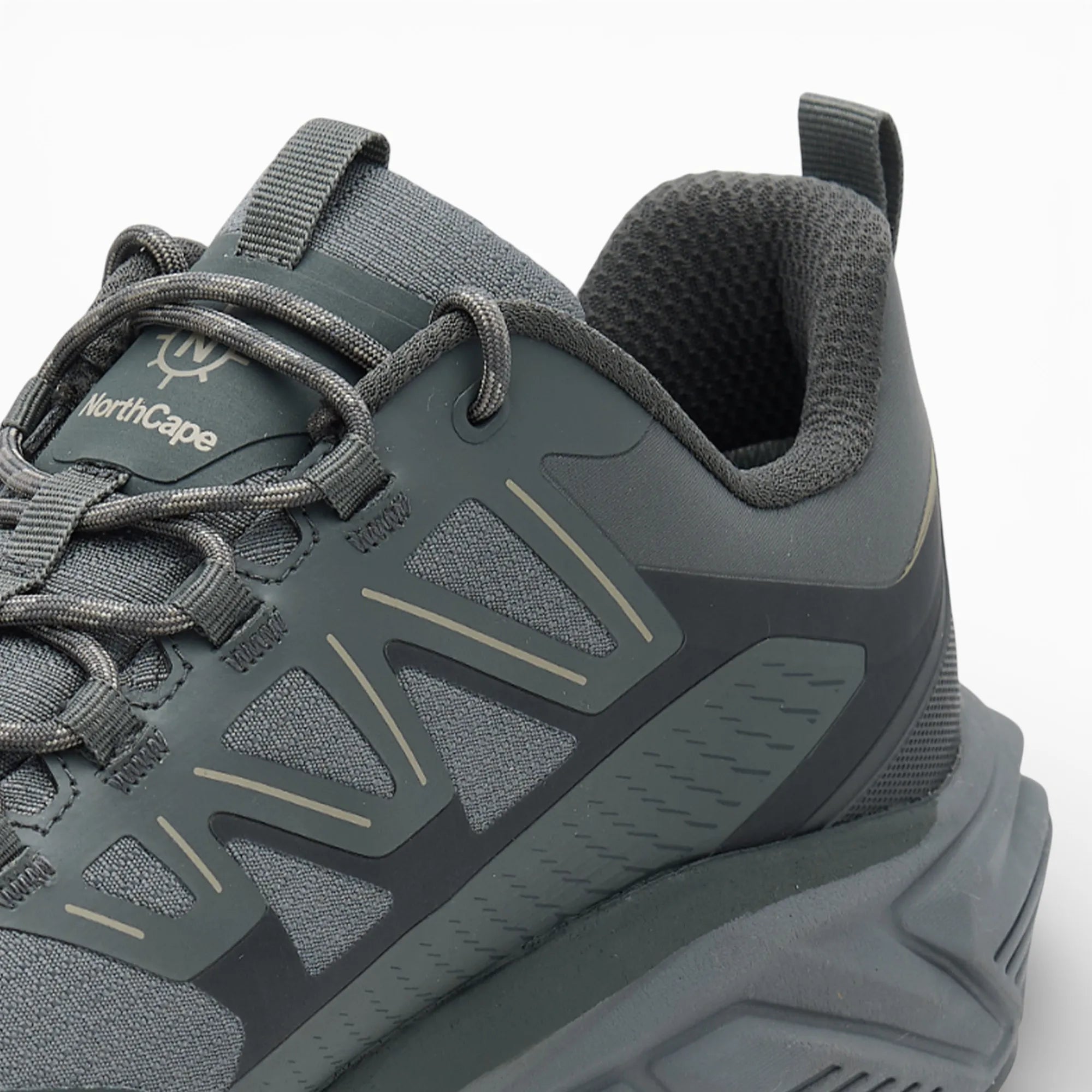 Gray athletic shoe with visible branding on a white background