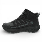Black hiking boot on a white background