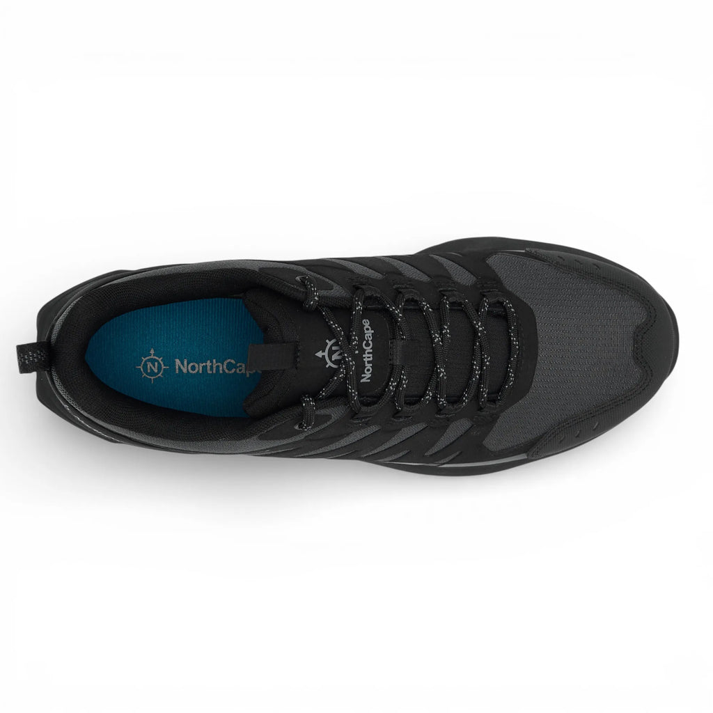 Black sneaker with visible brand logo on a white background