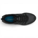 Black sneaker with visible brand logo on a white background