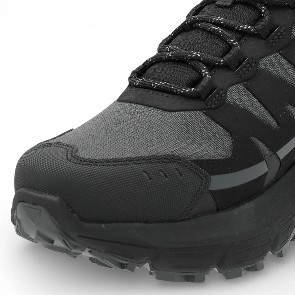 Black and gray hiking shoe on a white background