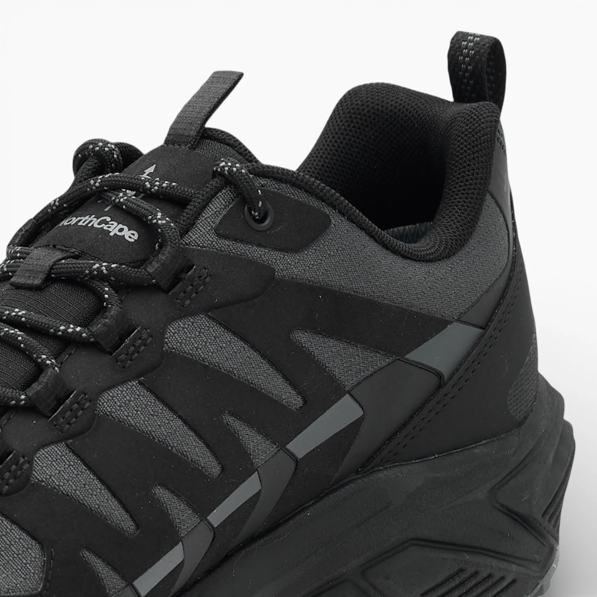 Black and gray sneaker with 'NorthCape' branding on a white background