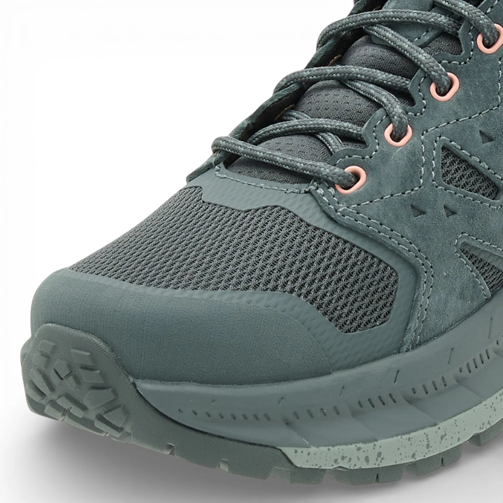 Green hiking shoe with a textured sole on a white background
