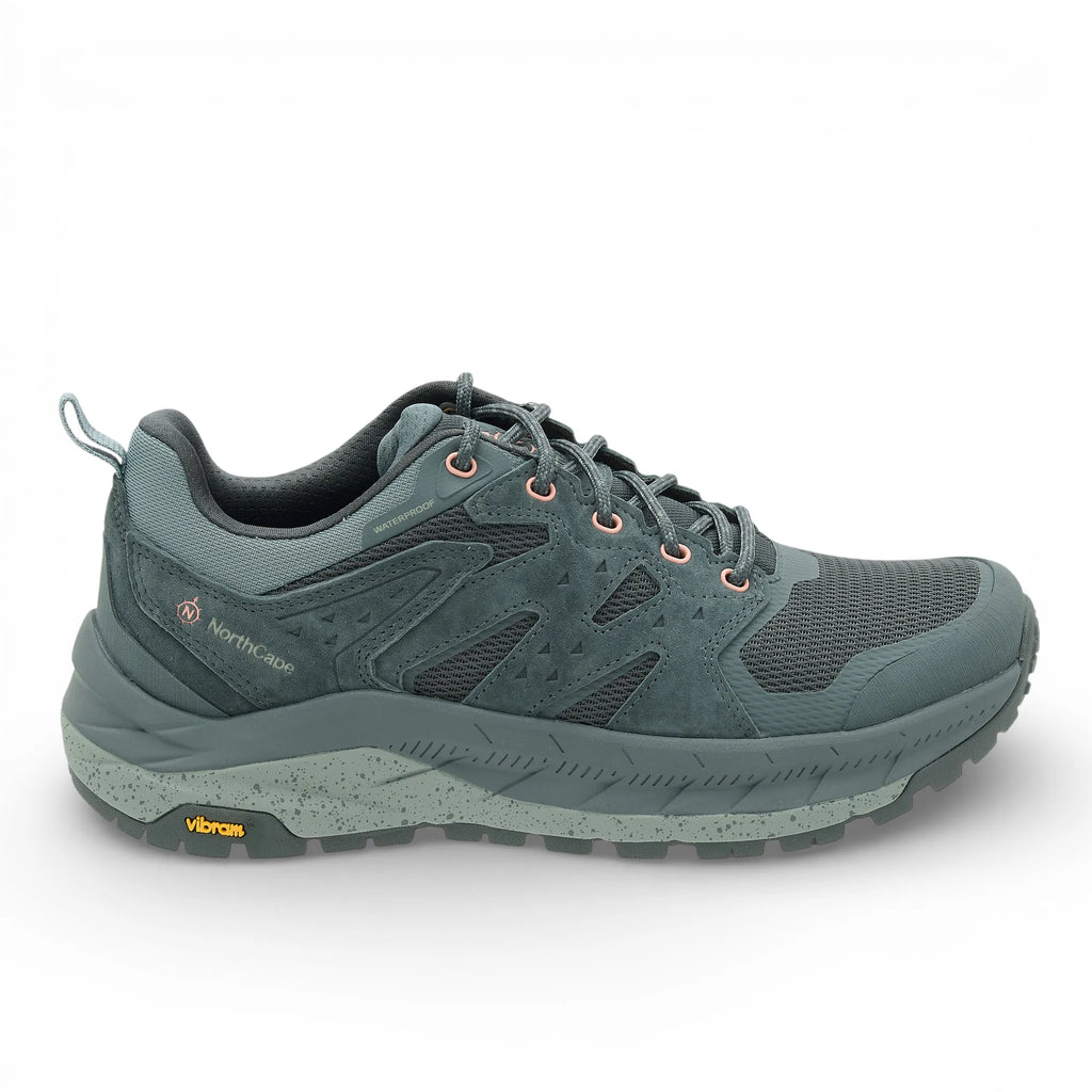 Green running shoe with brand logo on a white background