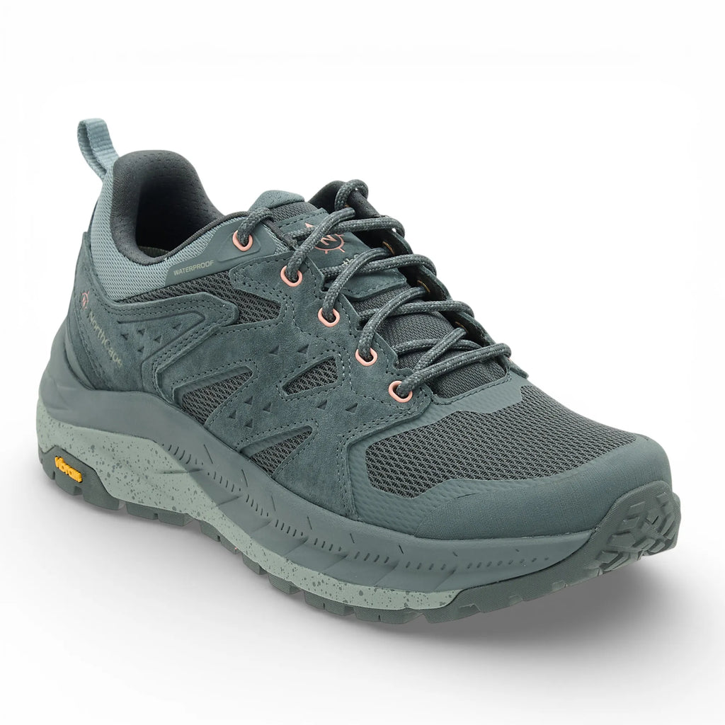 Green hiking shoe on a white background