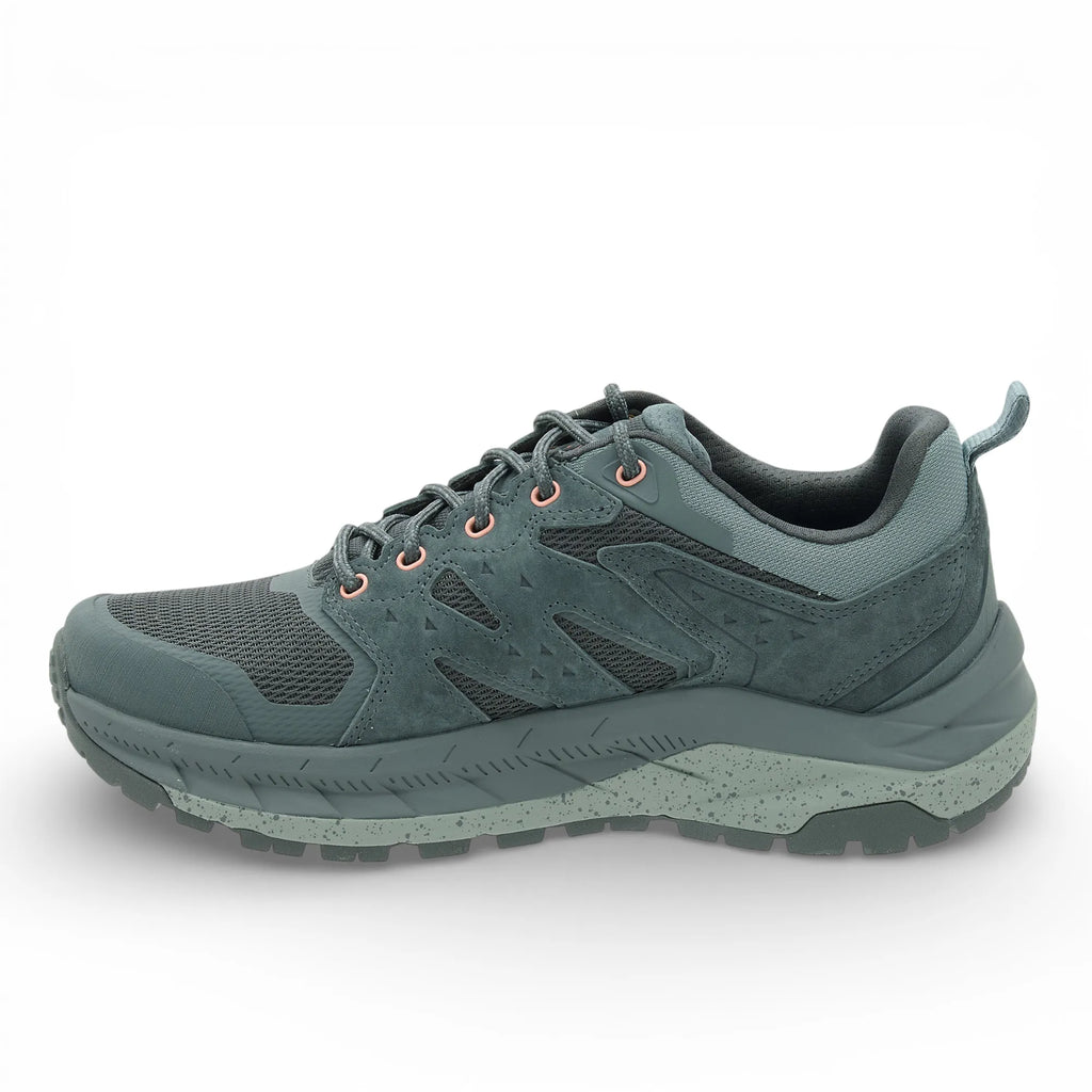Green hiking shoe on a white background