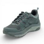 Green hiking shoe on a white background