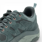Green hiking shoe on a white background