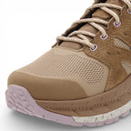 Brown hiking shoe with pink accents on a white background
