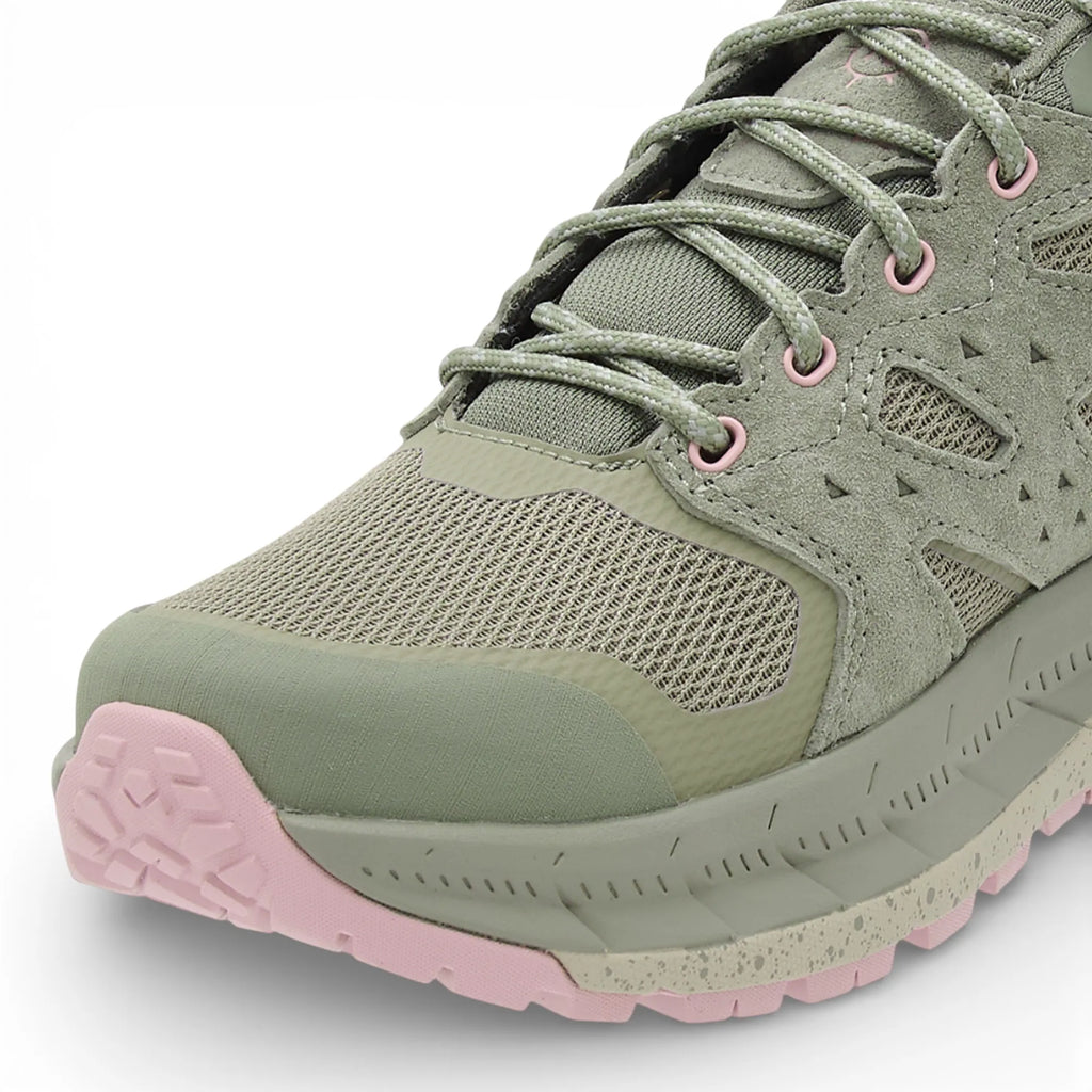 Green and pink sneaker on a white background
