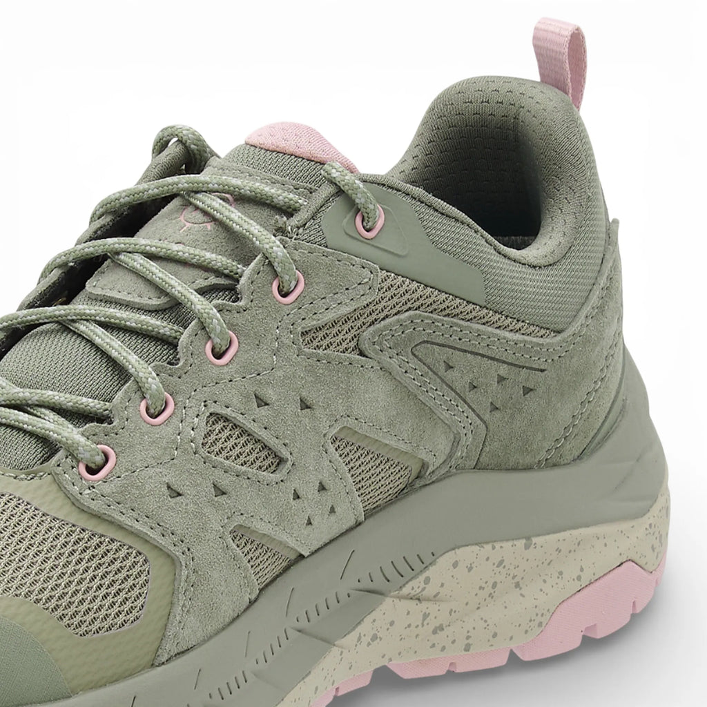 Green and pink sneaker on a white background