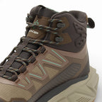 Brown hiking boot with visible brand logo on a white background