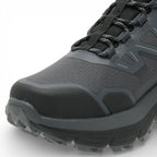 Gray hiking boot with black laces on a white background