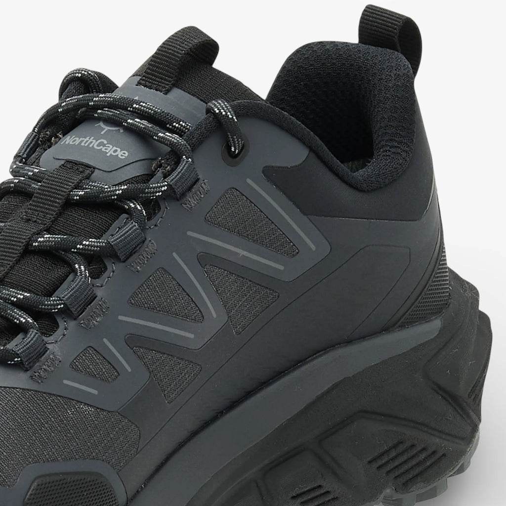 Black hiking shoe with visible brand logo on a white background