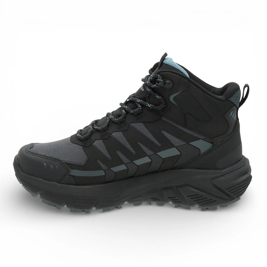 Black hiking boot with gray accents on a white background