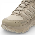 Beige hiking boot with brand logo on a white background