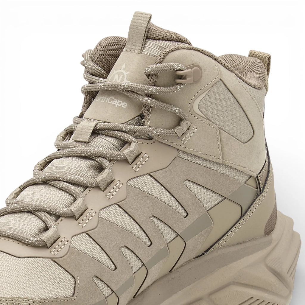 Beige hiking boot with brand logo on a white background