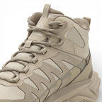 Beige hiking boot with brand logo on a white background