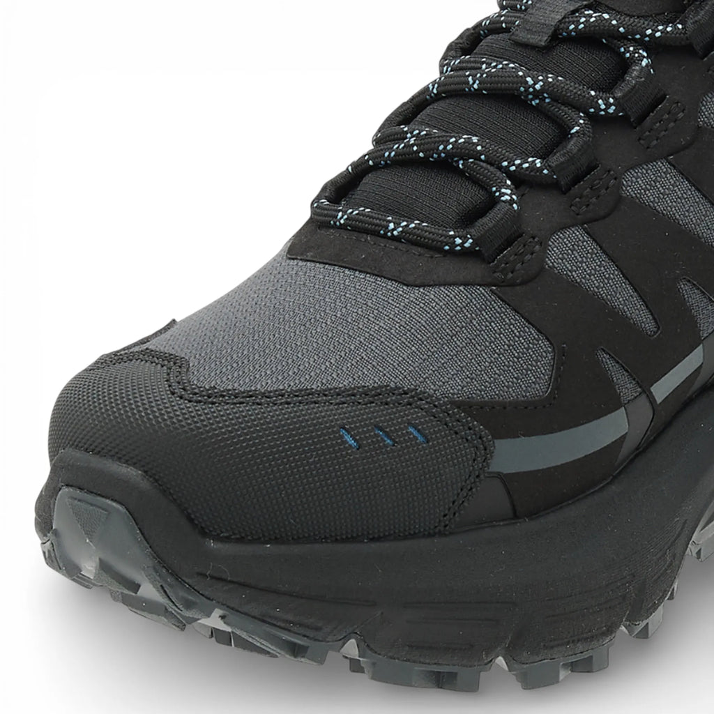 Close-up of a black and gray hiking boot with a white background