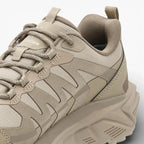 Beige sneaker with a textured design on a light gray background